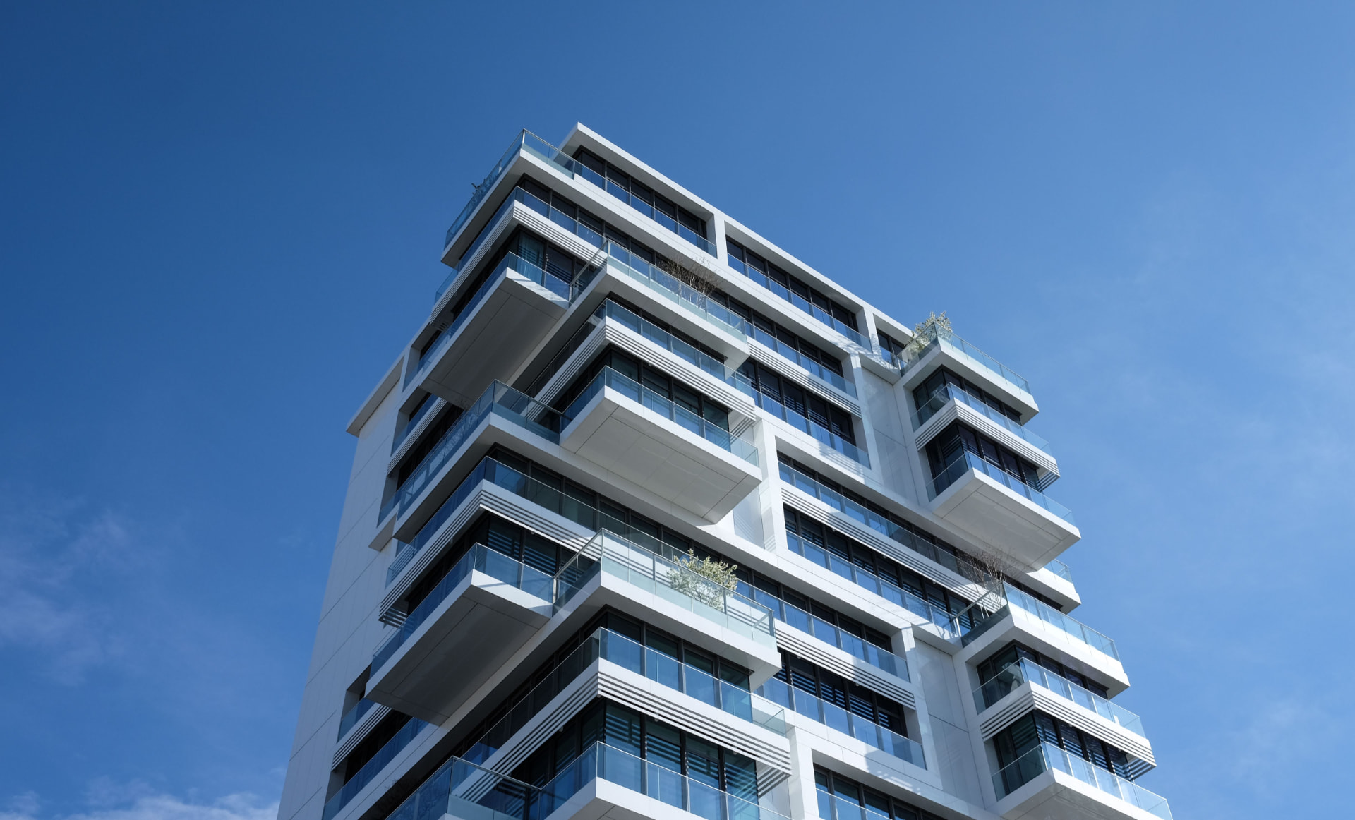 Singapore condominium building against a clear blue sky